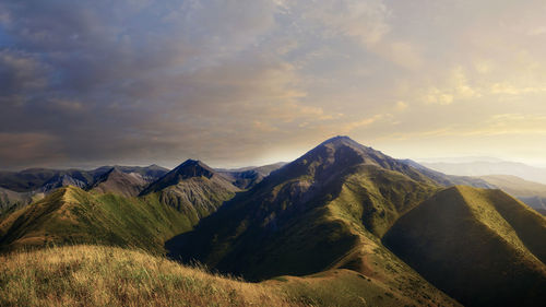 Scenic view of mountains against sky during sunset