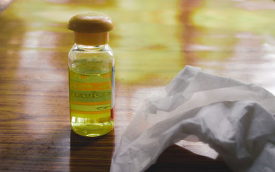 Close-up of glass bottle on table