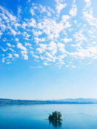 Scenic view of sea against blue sky