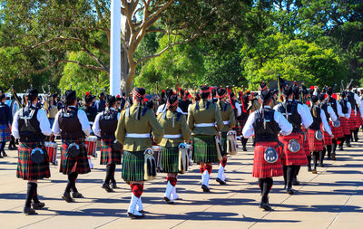 People walking in military uniform