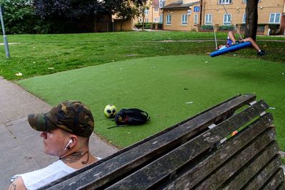 High angle view of man lying on grass