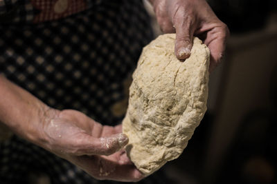 Close-up of hand holding ice cream