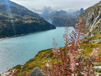 Scenic view of lake and mountains against sky