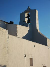 Low angle view of building against blue sky