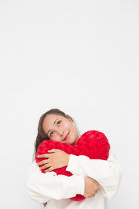 Portrait of cute baby girl against white background