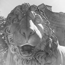 Low angle view of statue against building