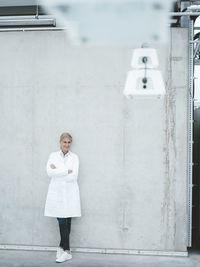 Agronomist standing in front of wall at laboratory