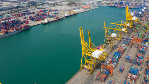 Container ship terminal, and quay crane of container ship at industrial port with shipping container 