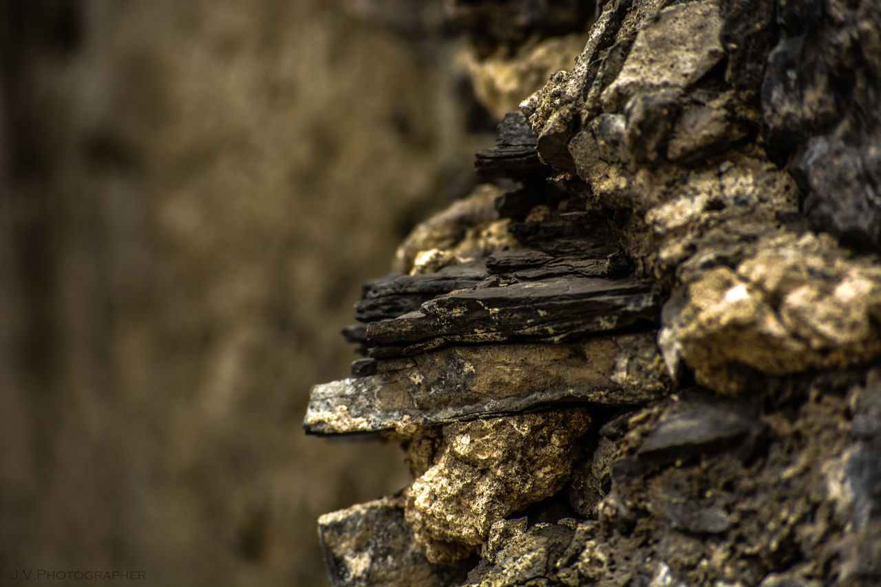 CLOSE-UP OF STACK OF STONE