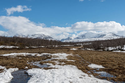 Scenic view of mountains against sky during winter