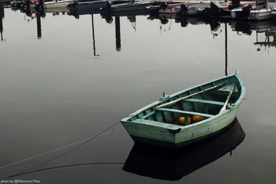 High angle view of fishing boats moored at lake