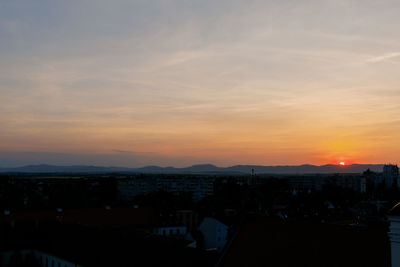 High angle view of cityscape against sky during sunset