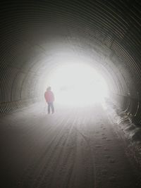 Full length of woman in tunnel