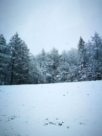 Scenic view of landscape against sky during winter