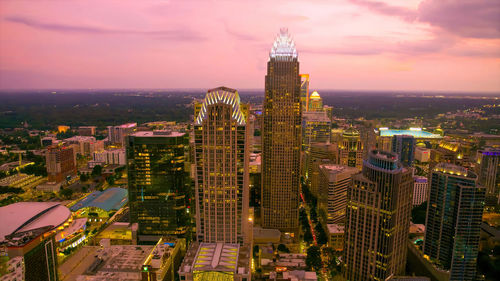 High angle view of illuminated cityscape against sky during sunset charlotte,usa