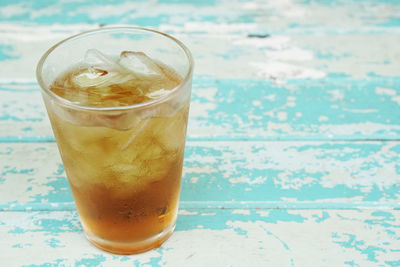 Close-up of beer glass on table