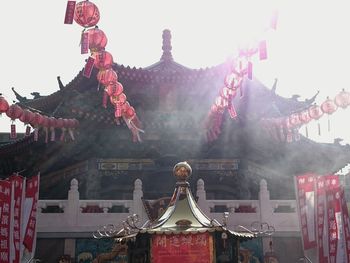 Low angle view of statue against temple