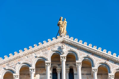 Low angle view of historical building against clear blue sky