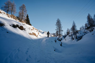 Scenic view of snow covered mountains against sky