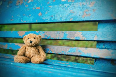 Close-up of stuffed toy on bench