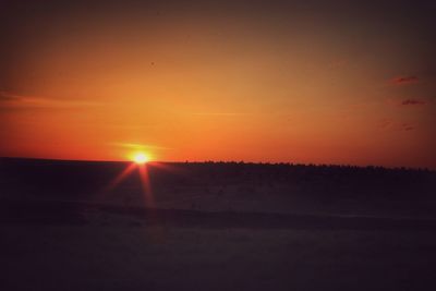 Scenic view of silhouette landscape against sky during sunset