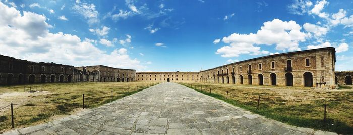 View of historical building against cloudy sky