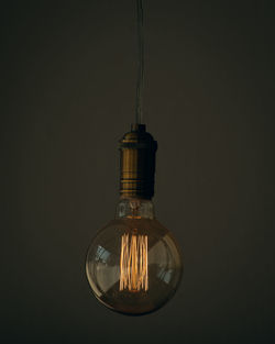 Close-up of illuminated light bulb