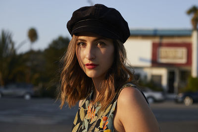 Portrait of beautiful young woman in hat