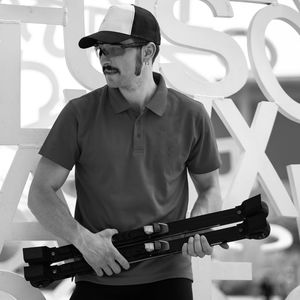 Young man holding ski roller