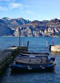Scenic view of sea and mountains against sky