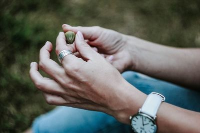 Midsection of woman holding hands