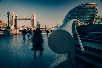 People walking on bridge