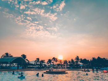 Scenic view of swimming pool against sky during sunset