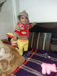 Portrait of cute boy wearing hat at home
