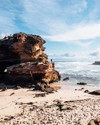 Scenic view of sea against cloudy sky