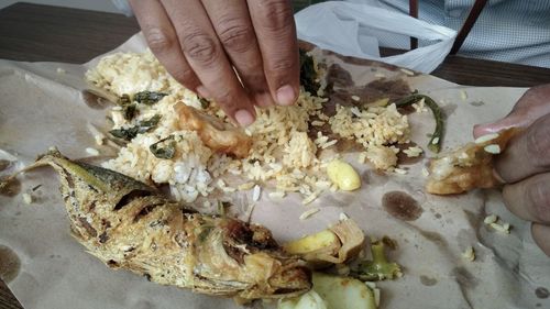 Midsection of person preparing food on table