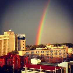 Rainbow over city