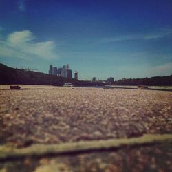 Surface level of bridge against blue sky