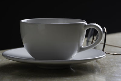 Close-up of coffee cup on table