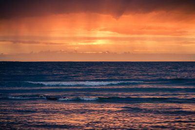 Dramatic sky over sea during sunset