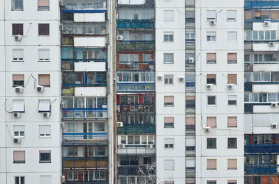 Building with windows and balconies of apartments