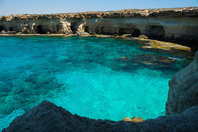 Scenic view of sea against blue sky