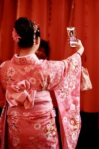 Rear view of two women wearing mask