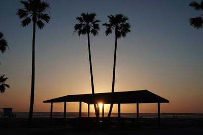 Scenic view of beach against sky during sunset