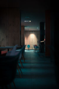 Empty chairs and tables in restaurant