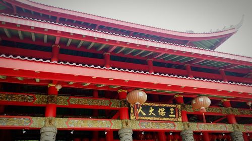 Low angle view of lantern hanging outside building