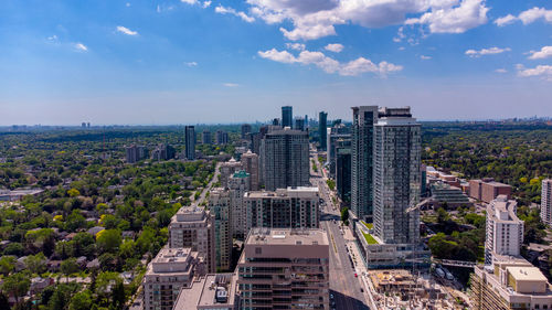 High angle view of buildings in city against sky