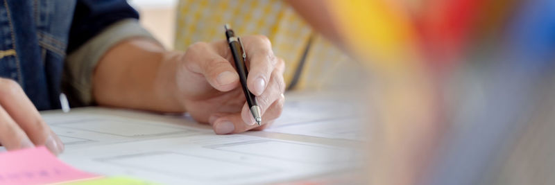 Close-up of woman working on table
