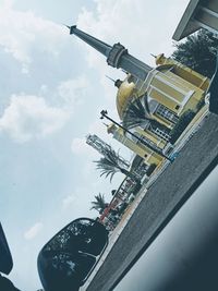 Low angle view of cars on road against sky