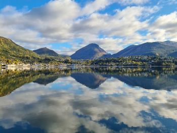 Scenic view of lake and mountains against sky. sandane city norway.